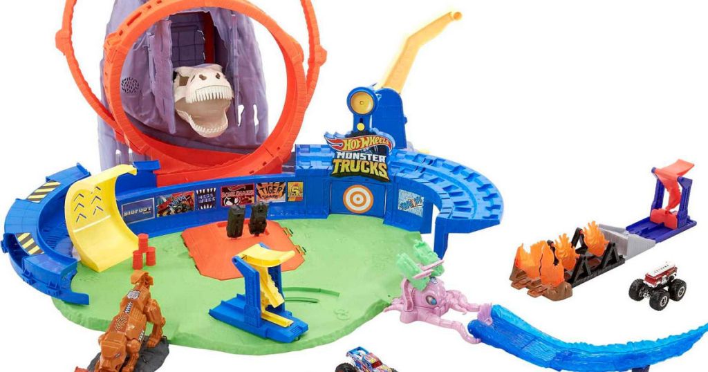 toy car track with dinosaur and volcano on it