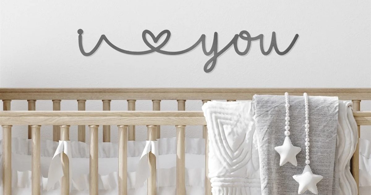 i heart you metal sign in baby's room with crib