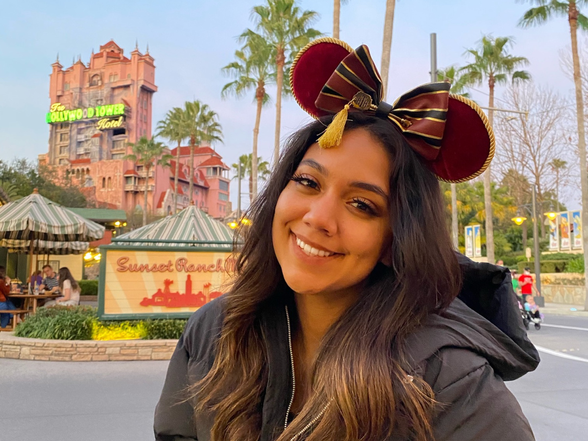 disney world tips woman with tower ears in front of tower of terror