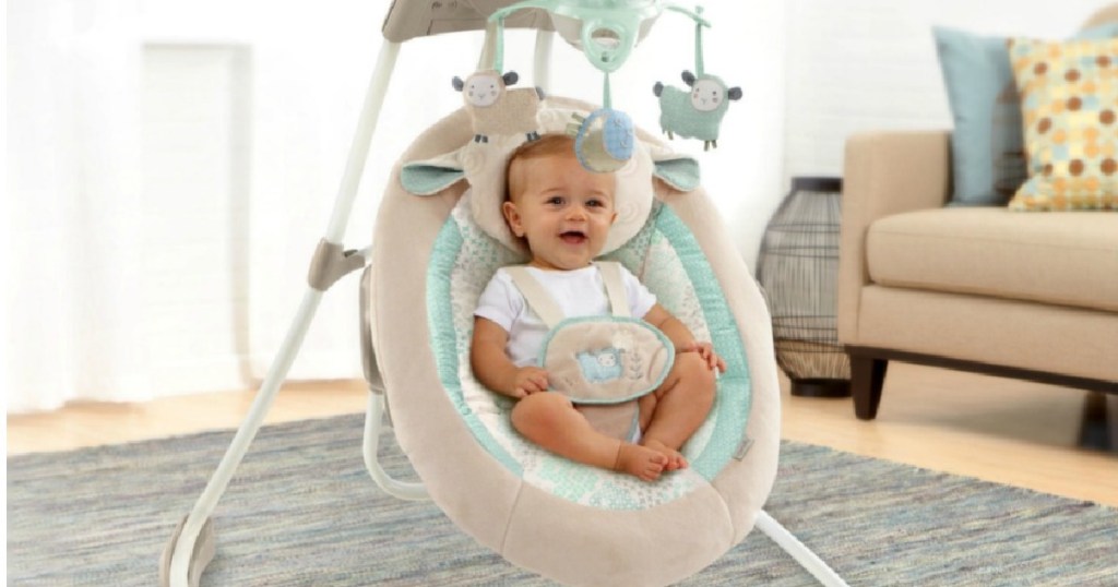 baby in tan cradle swing 