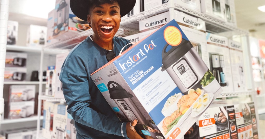 Cam holding Instant Pot in store