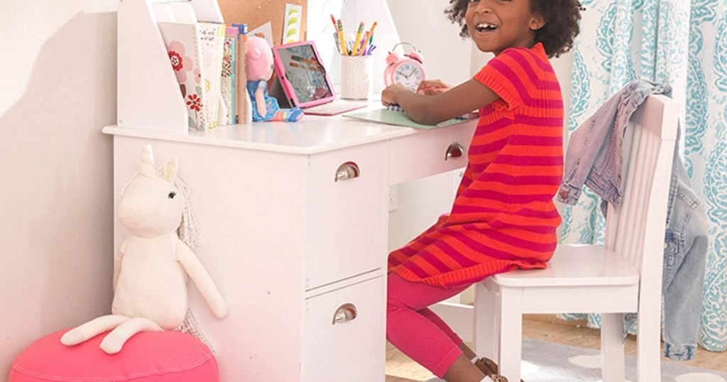 kidkraft children's study desk with girl sitting down in chair