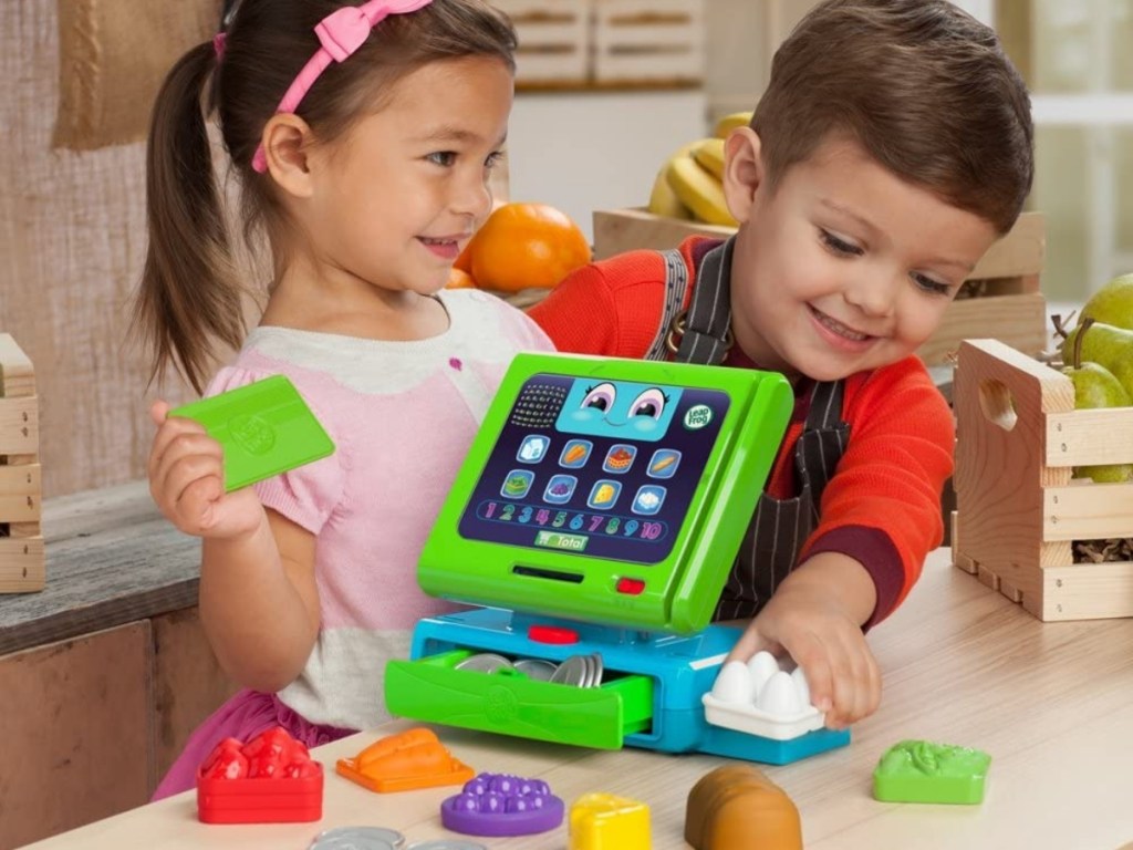 kids playing with leapfrog cash register