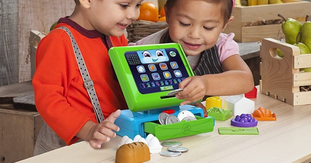 kids playing with leapfrog cash register