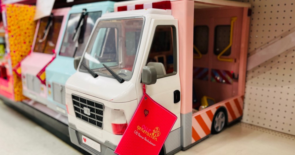 pink doll ambulance on shelf 