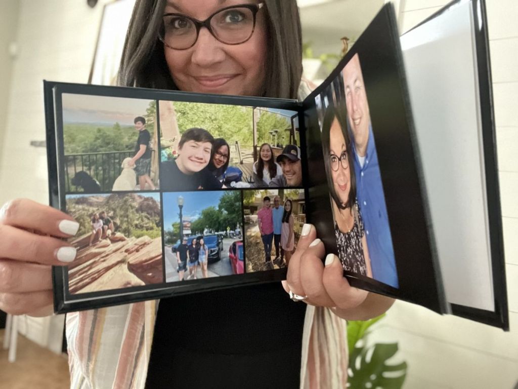 woman holding open family photo book