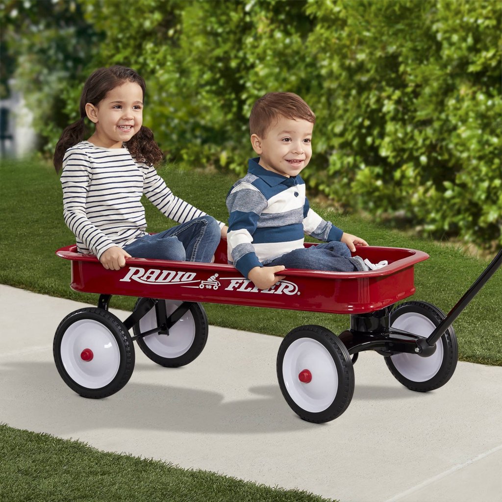 toddlers riding in Radio Flyer Original Classic Red Wagon