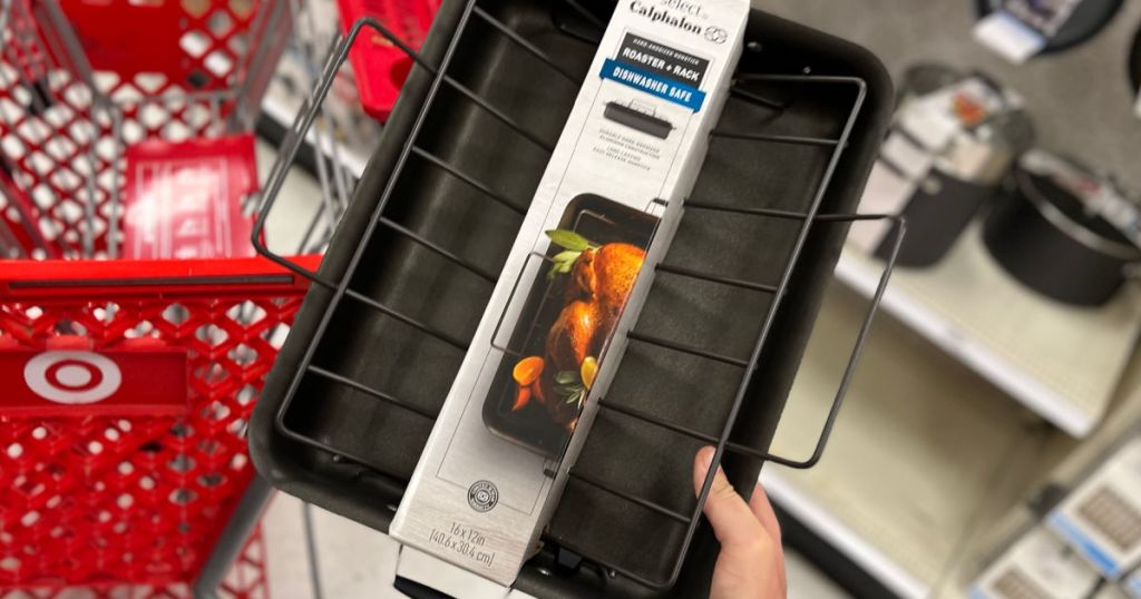 hand holding roasting pan in front of cart 