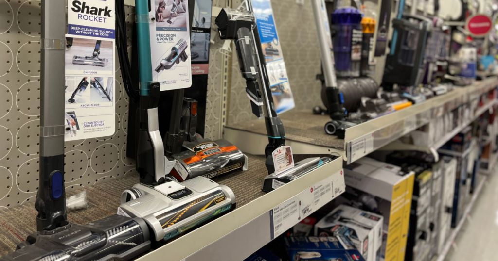 silver vacuum cleaners on shelf 