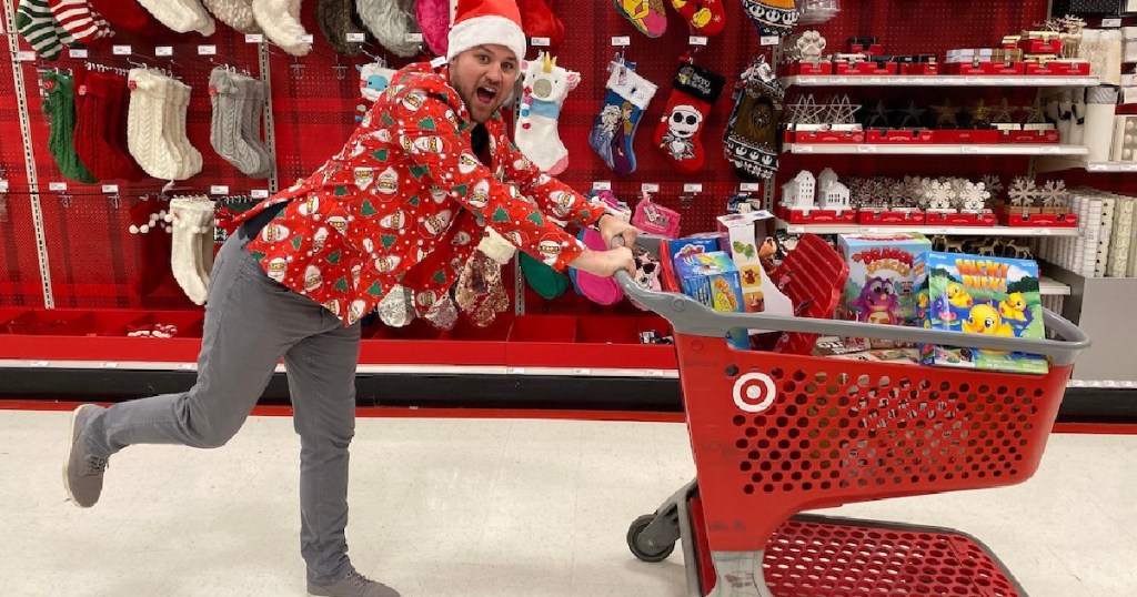 Man dressed in Christmas attire pushing shopping cart in Target