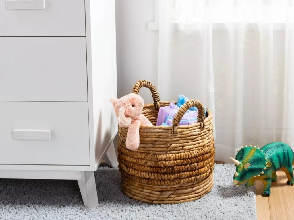 threshold natural round storage basket with toys in room