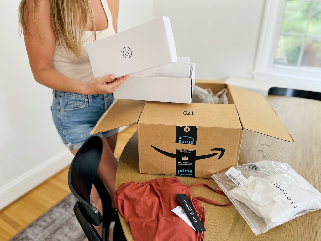 woman opening amazon prime wardrobe try before you buy box
