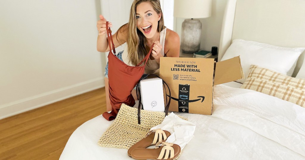 woman leaning over bed with amazon prime wardrobe try before you buy