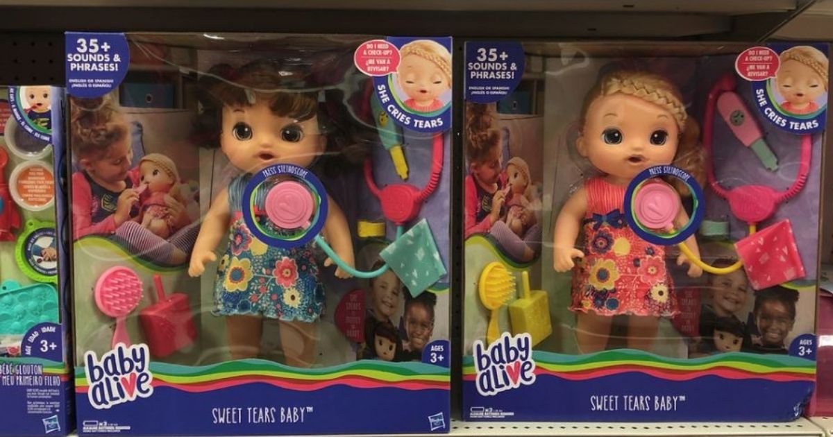 Baby Alive brunette and blonde dolls on store shelf