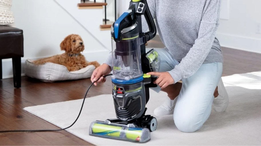woman with bissell vacuum