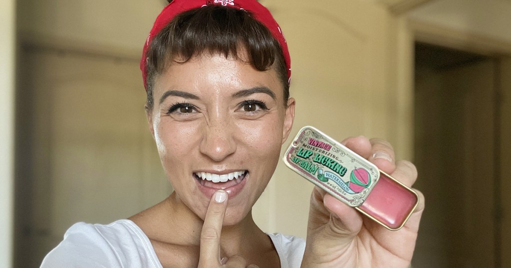 woman using tinte cosmetics lip balm tin