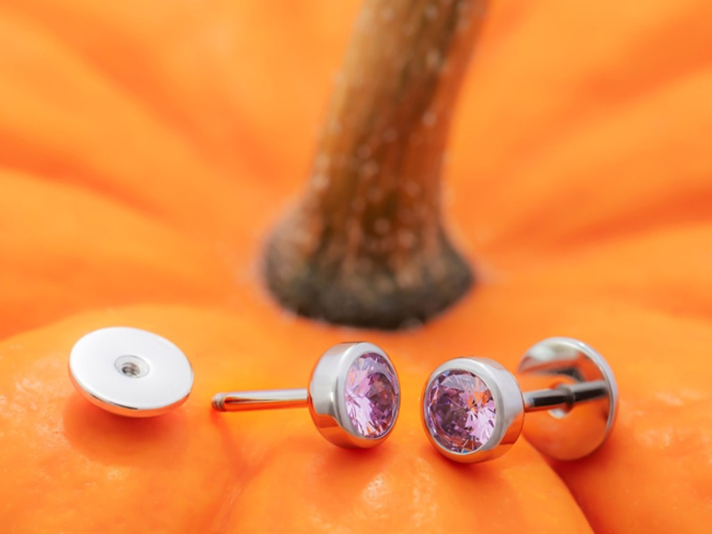 pair of earrings on a pumpkin