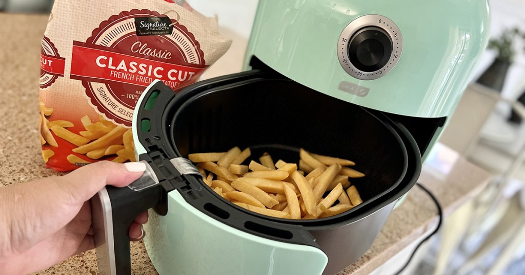 dash air fryer with fries in basket