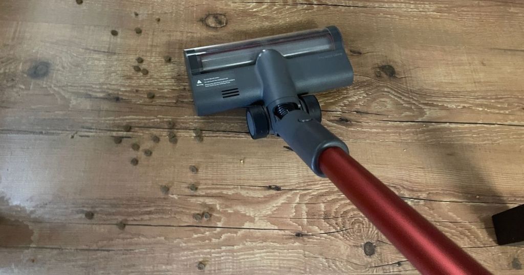 red stick vacuum cleaning hardwood floor