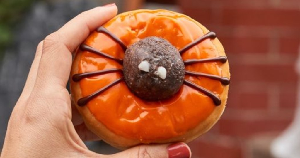 holding a spider doughnut