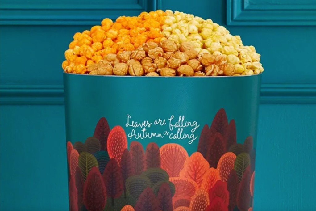 fall leaves popcorn tin w/ popcorn in it