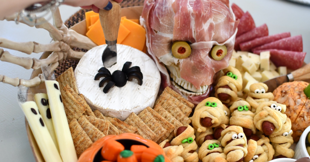 Snack board filled with halloween inspired spooky treats