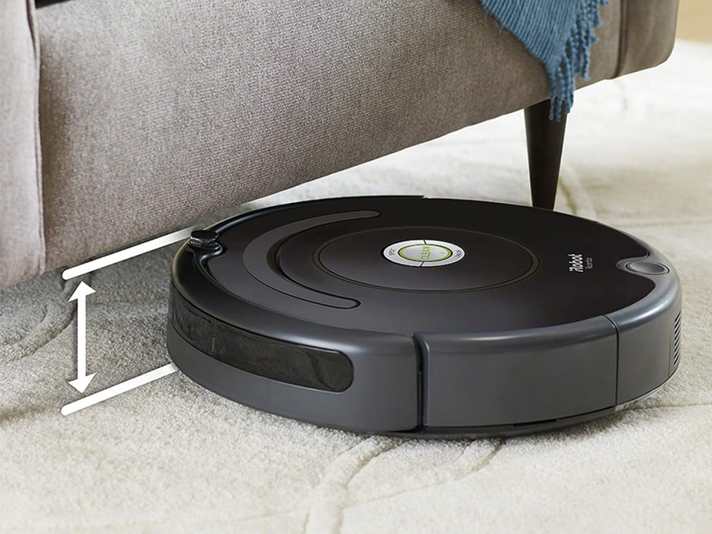 robot vacuum cleaning near couch
