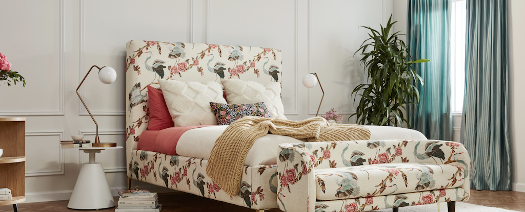 joybird bed with floral and bird design in bedroom 