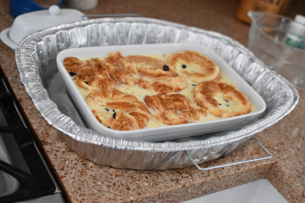 placing bread pudding in a water bath