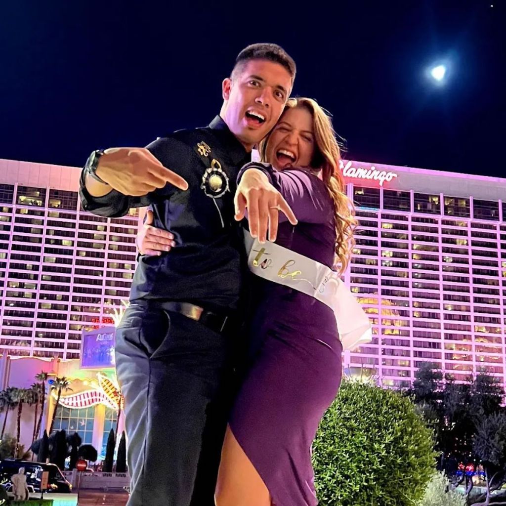 man and woman standing outside with proposal ring in las vegas