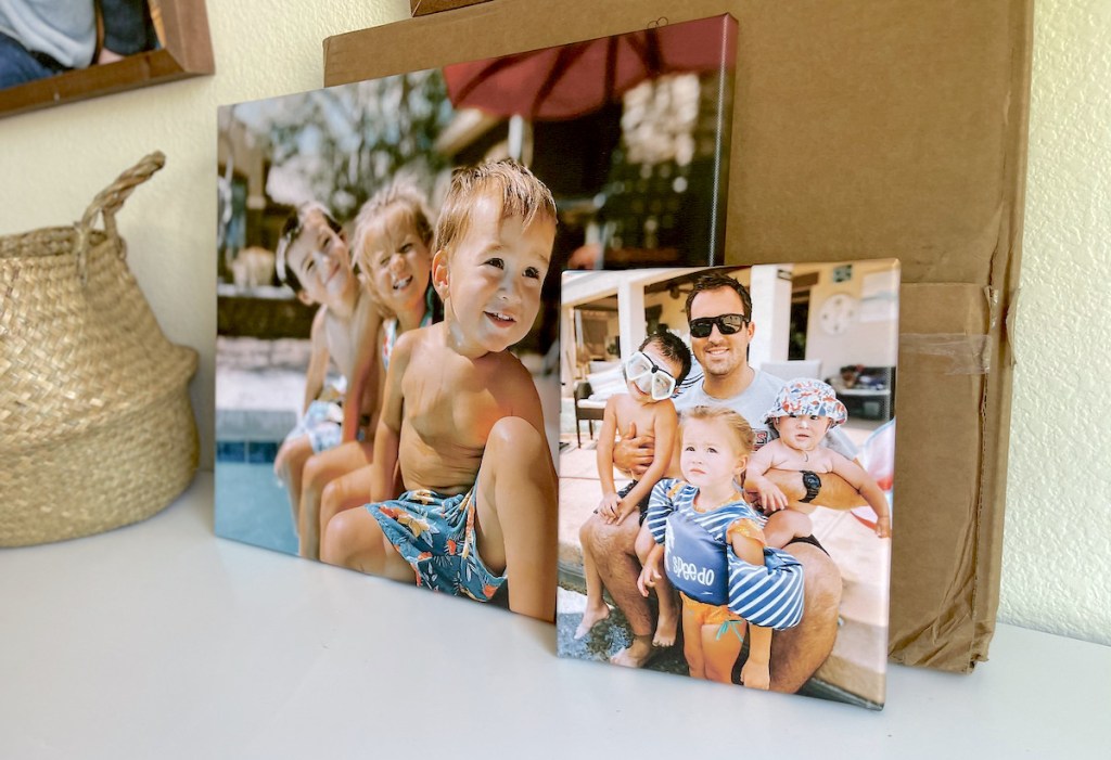 two family canvas prints leaning against wall