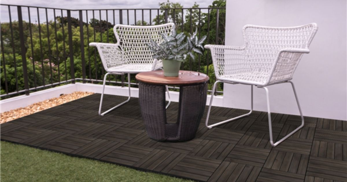 black wood tile on porch with patio furniture on it