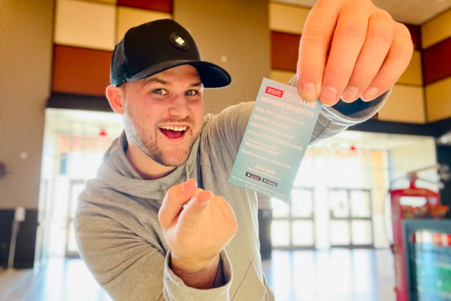 man holding Cinemark Movie Club ticket