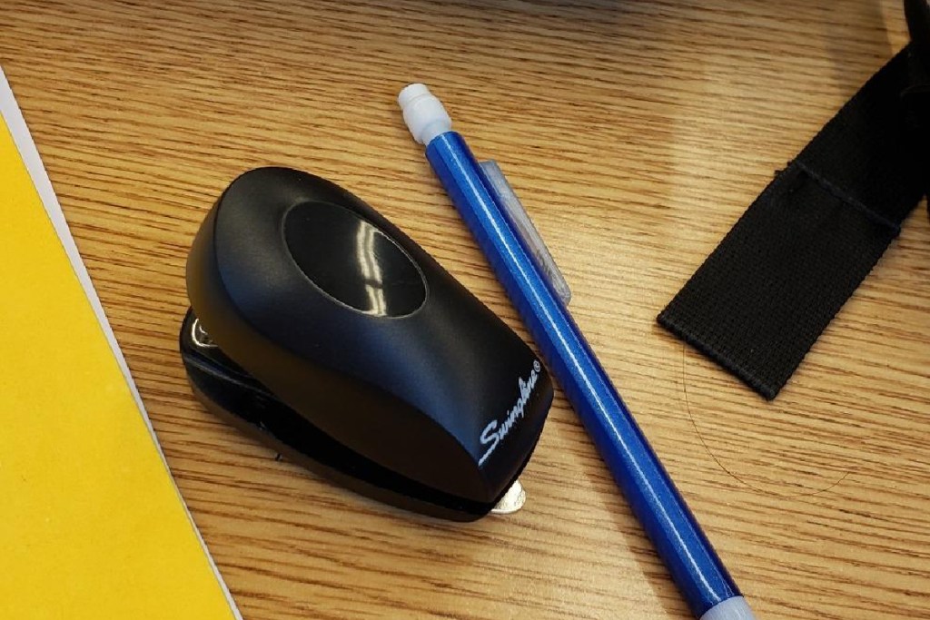 swingline mini stapler next to a pencil