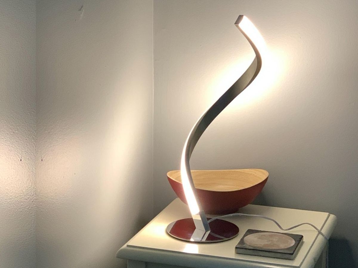 curvy led lamp on bedroom end table