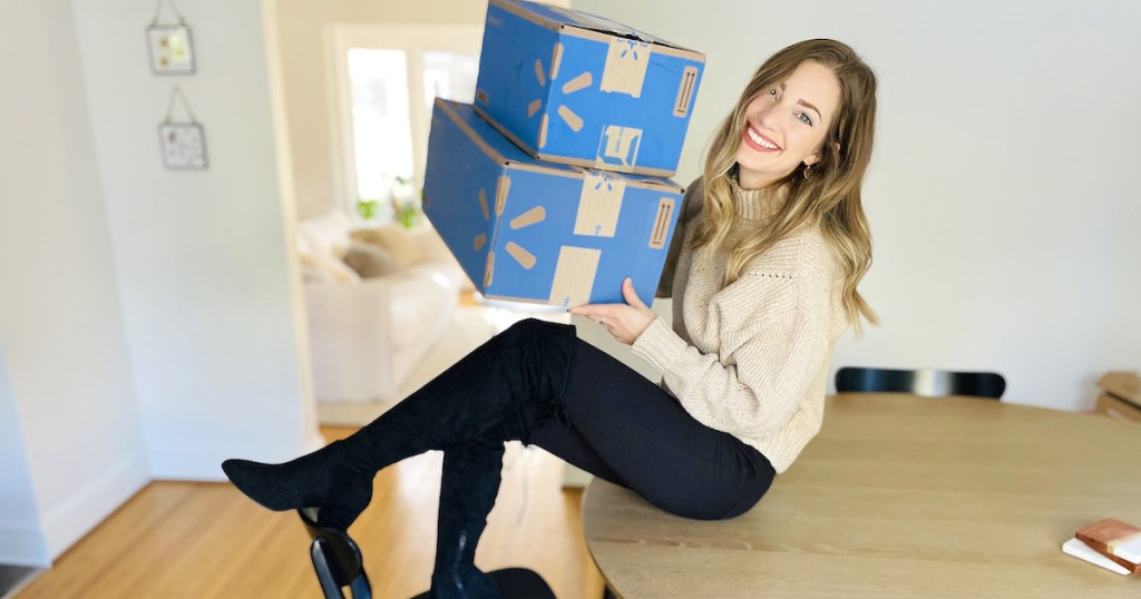 woman sitting with stacked walmart boxes