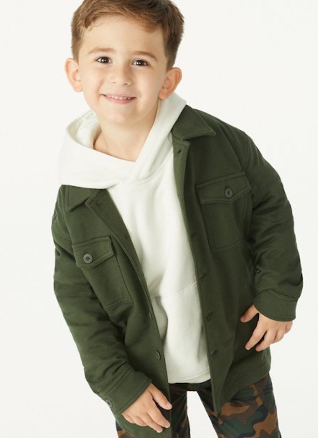 stock photo of boy wearing dark green jacket and white sweatshirt