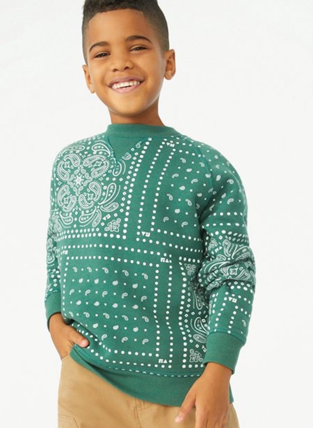 stock photo of boy wearing green sweater