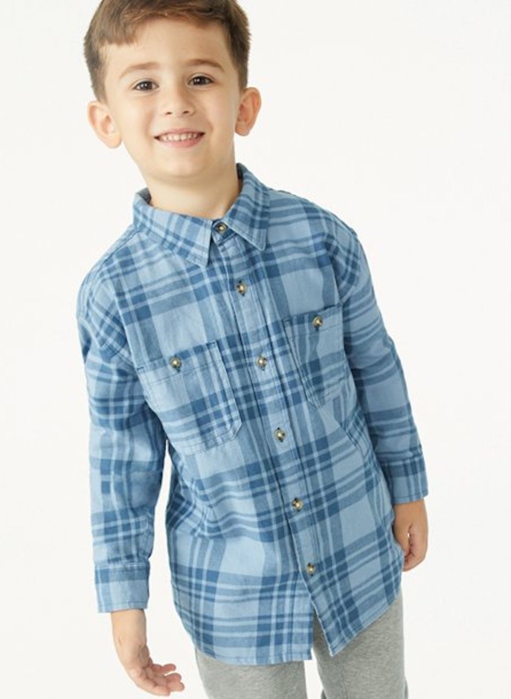 stock photo of boy wearing blue plaid shirt