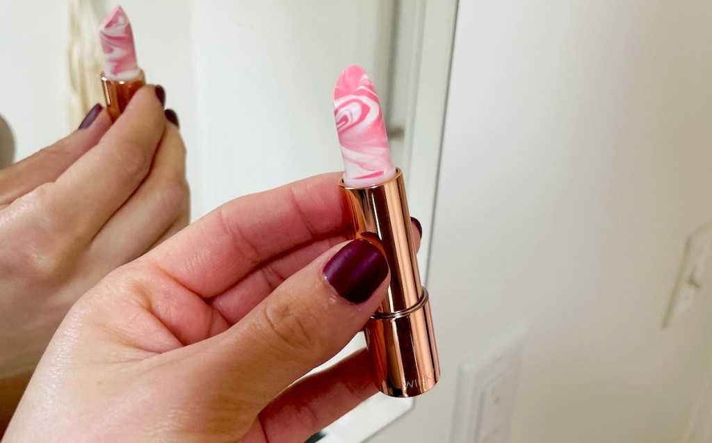 close up of winky lux pink and white marble lipstick