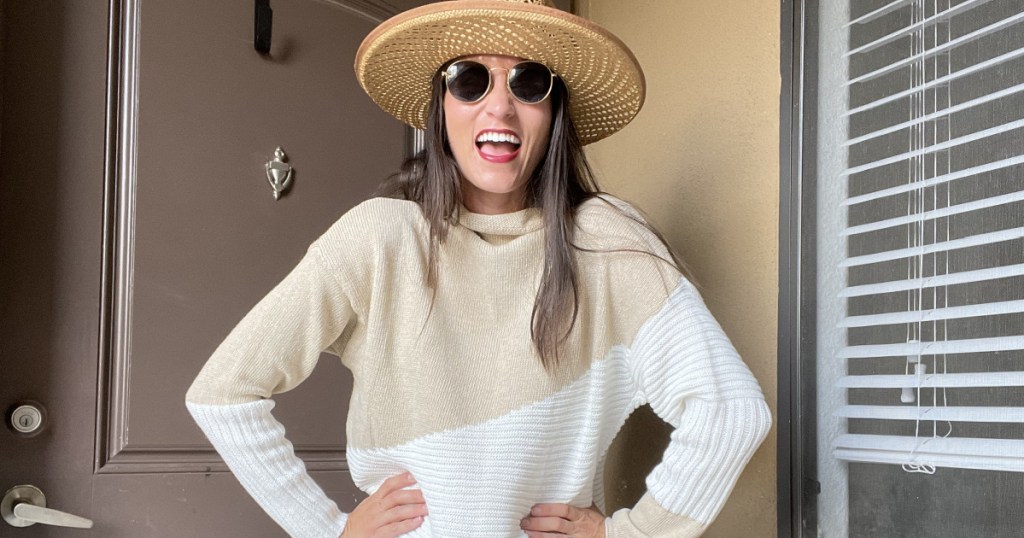 woman with hat and sweater and sunglasses 