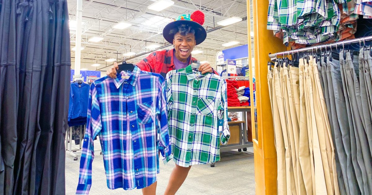 Woman holding two flannels at Academy Sports + Outdoor