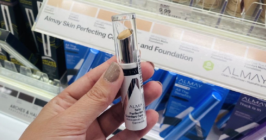 hand holding up Almay Concealer