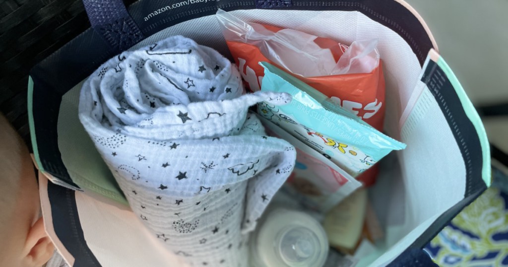 large bag filled with baby stuff