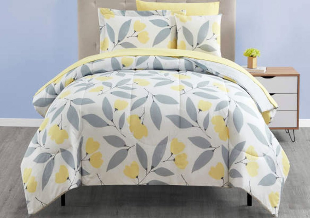 bed made with yellow and grey comforter set