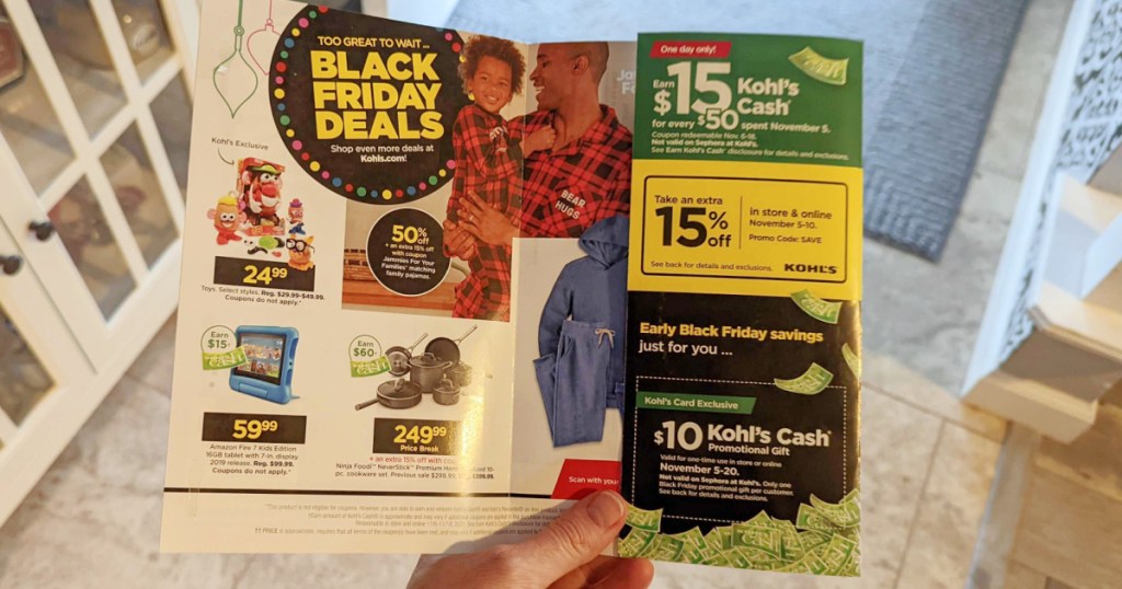 person holding Black friday ad for Kohl's