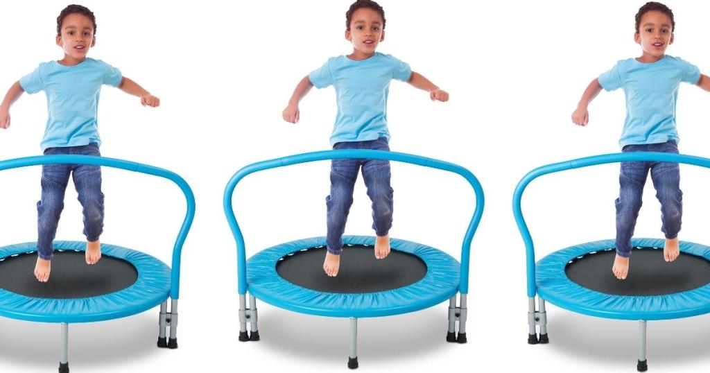 little boy bouncing on bounce buddies blue trampoline