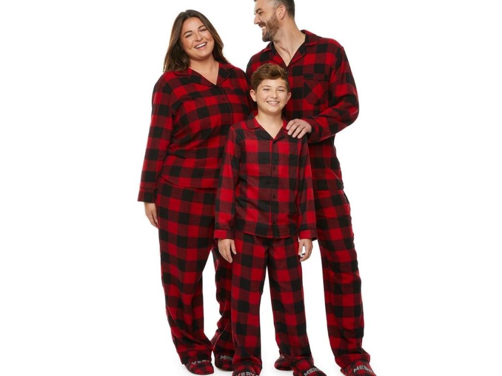 family wearing buffalo plaid matching pajamas