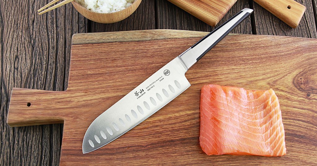knife and salmon on a cutting board