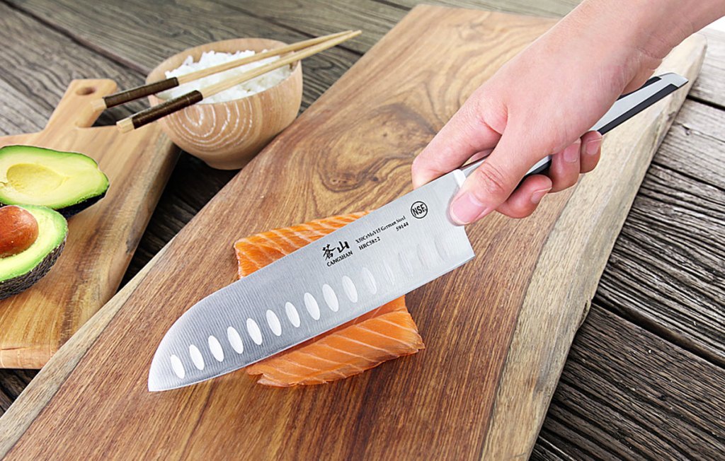 using knife to cut salmon